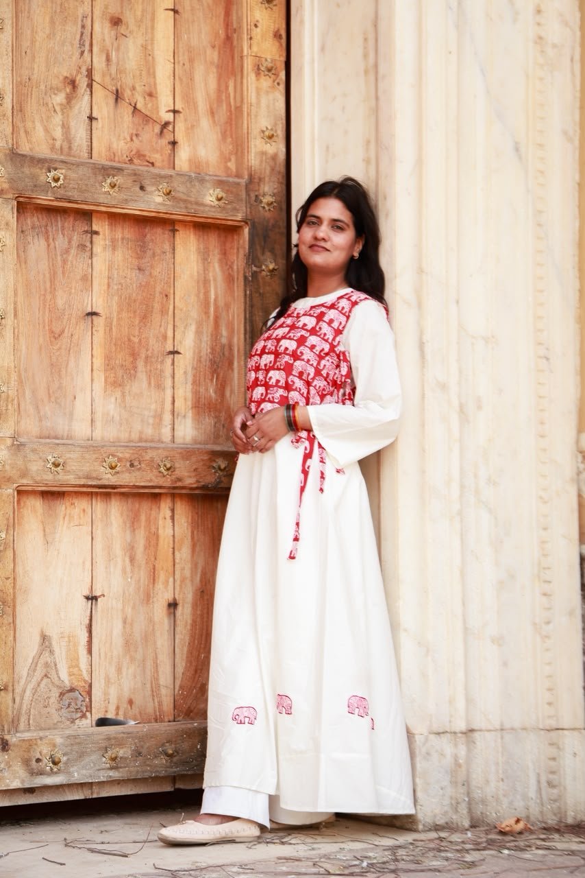 Heritage long gown with elephant patch work detailings  Paired with elephant print crop jacket